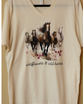 V-neck T-Shirt with an image of horses running forward. Script text reads: wildflowers and wild horses